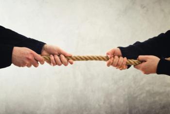 Tug of war. Hands pulling rope to opposite sides | Image Credit: © Bits and Splits - stock.adobe.com