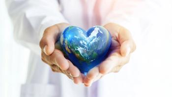 Hands hold Earth ball in heart shape on Doctor hands for World Health Day content and copy space.Elements of this image furnished by NASA | ©Flavius - stock.adobe.com