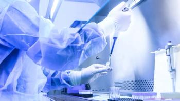 Eugene/Stock.adobe.com - image of laboratory personnel conducting bioanalysis testing wearing full cleanroom gear/PPE