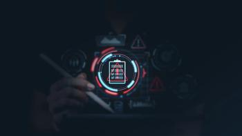 Hand holding a stylus over a tablet with futuristic risk management icons such as warning signs, data charts, and safety symbols on a dark background. | Image Credit: ©ImageFlow -stock.adobe.com
