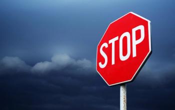 Conceptual stop sign with stormy background. Warning, caution and danger sign | Image Credit: © Rechitan Sorin - stock.adobe.com