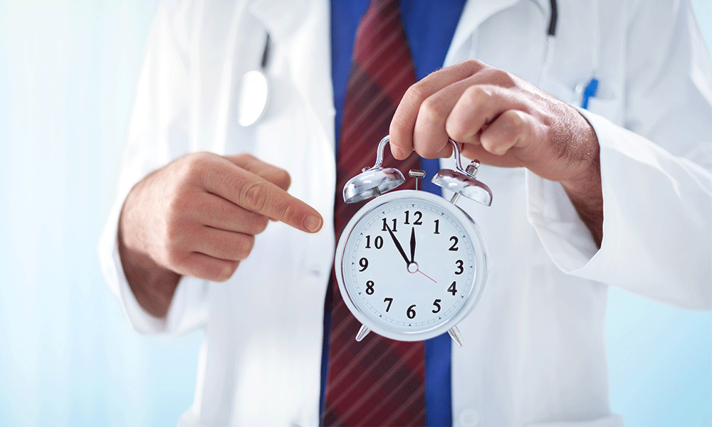 doctor holding clock