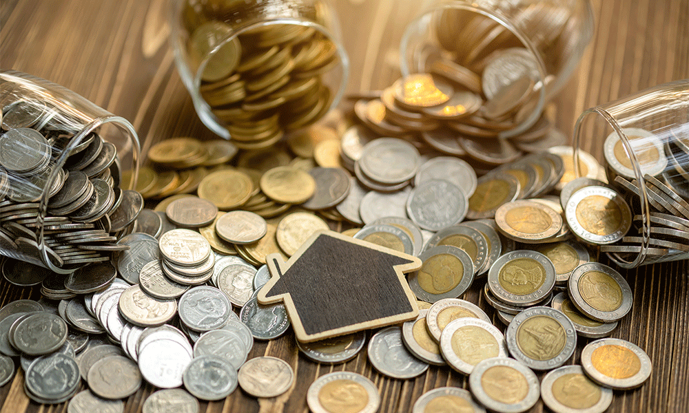 house icon over gold and silver coins