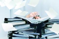 buried under paperwork | © Maren Winter - stock.adobe.com
