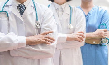 doctors standing arms folded