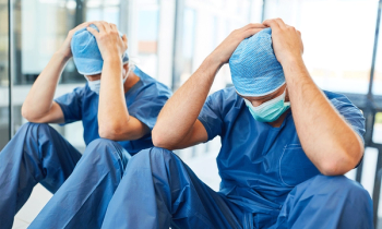 doctors holding heads