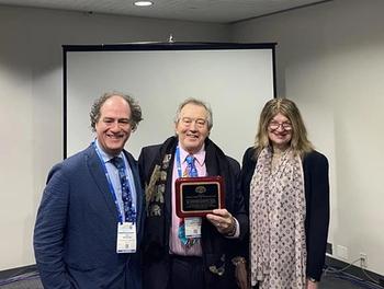 H. Steven Moffic, MD, with the Abraham L. Halpern Humanitarian Award, presented by John H. Halpern, MD; and Aida S. Mihajlovic, MD.