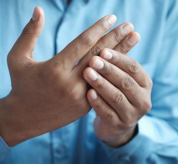 Person with rheumatoid arthritis with hand pain | Credit: UnSplash