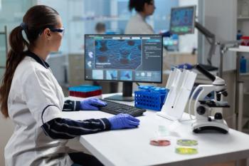 Researcher biochemist woman analyzing virus expertise working on coronavirus treatment in microbiology hospital laboratory. Chemist scientist typing biomedical research. Biochemistry examination | Image Credit: © DC Studio - stock.adobe.com
