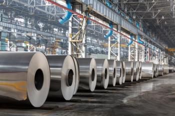Row of rolls of aluminum lie in production shop of plant. | Image Credit: © Pavel Losevsky - stock.adobe.com
