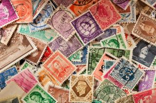 Colorful Vintage Used Postage Stamps | Image Credit: © Brent Hofacker - stock.adobe.com