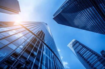 Low angle view of skyscrapers architectural glass | Image Credit: © zhouyilu - stock.adobe.com.