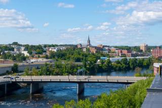 Manchester historic city skyline including Merrimack River, Granite Street Bridge and West Side Sainte Marie Parish church in Manchester, New Hampshire NH, USA. Manchester will play host to the Gordon Research Seminar later this summer. | Image Credit: © Wangkun Jia - stock.adobe.com