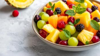 A refreshing bowl of mixed fruit salad featuring pineapple, grapes, melon. Generated with AI. | Image Credit: © aubriella - stock.adobe.com