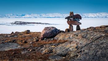 Inukshuk overlooking arctic landscape, Nunavut, Canada. | Image Credit: © Denis Comeau - stock.adobe.com