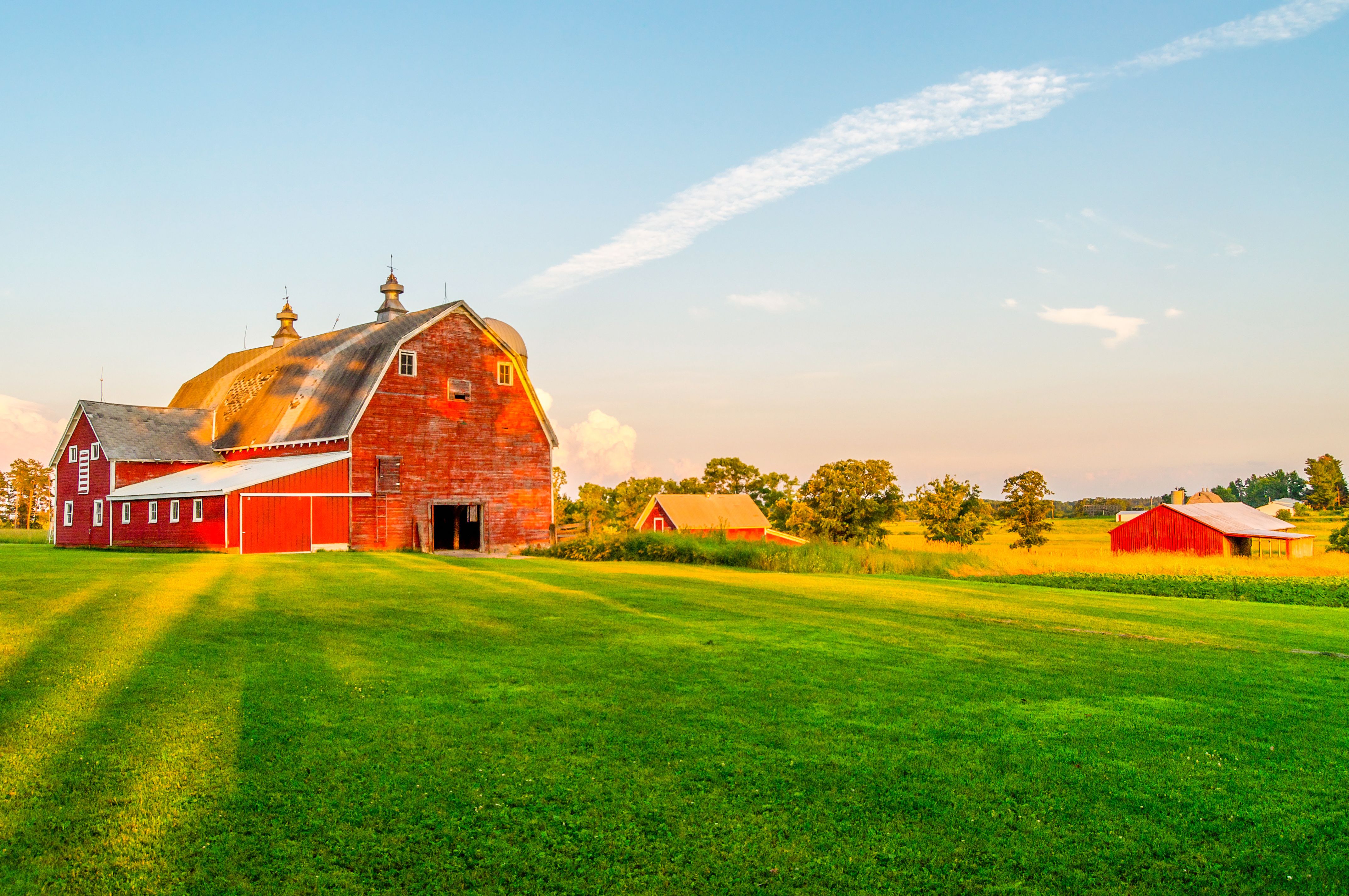 The Sun Begins To Set on a Farm in Minnesota | Image Credit: © Matt - stock.adobe.com