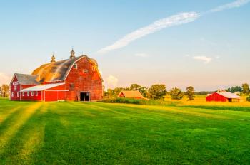 The Sun Begins To Set on a Farm in Minnesota | Image Credit: © Matt - stock.adobe.com