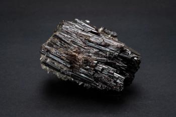 Piece of Hubnerite mineral from Pasto Bueno, Peru. A mineral consisting of manganese tungsten oxide with black monoclinic prismatic submetallic crystals with fine striations | Image Credit: © MyriamB - stock.adobe.com