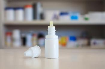 Eye drops medicine bottle with pharmacy store shelves background | Image Credit: © Kwangmoozaa - stock.adobe.com.