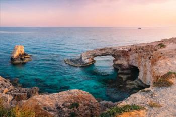 Ayia Napa love bridge on mediterranean sea at sunset, Cyprus | Image Credit: © gilitukha - stock.adobe.com