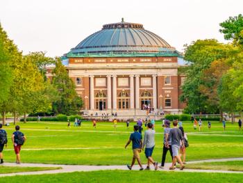College students walk on the quad lawn of the University of Illinois campus in Urbana, Illinois. | Image Credit: © Leigh Trail - stock.adobe.com