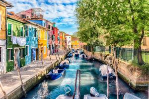 Colorful houses along the canal, island of Burano, Venice, Italy | Image Credit: © marcorubino - stock.adobe.com