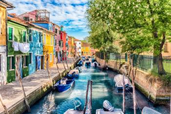 Colorful houses along the canal, island of Burano, Venice, Italy | Image Credit: © marcorubino - stock.adobe.com