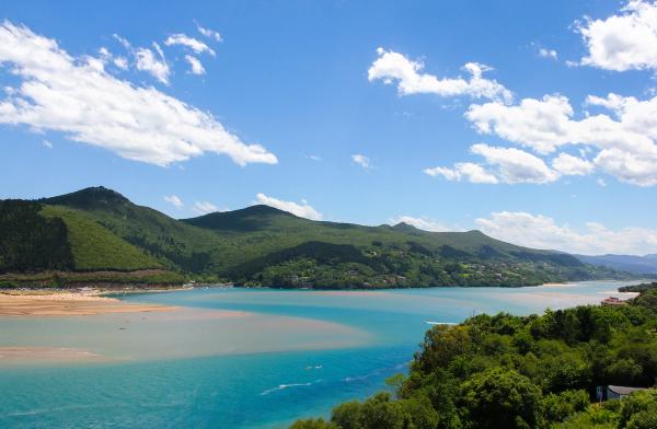 Splendid views of Urdaibai biosphere reserve with mountains, blue sky and white clouds on the background, in the Basque Country | Image Credit: © Josu Ozkaritz - stock.adobe.com