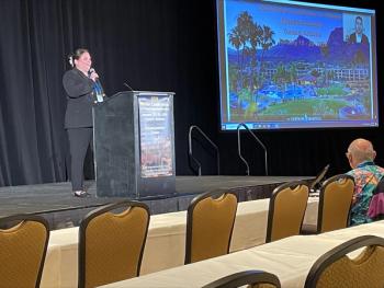 Spectroscopy magazine editorial director Caroline Hroncich congratulating Eduardo Bolea-Fernández for winning the Spectroscopy Emerging Leader in Atomic Spectroscopy Award. | Photo Credit: © Will Wetzel