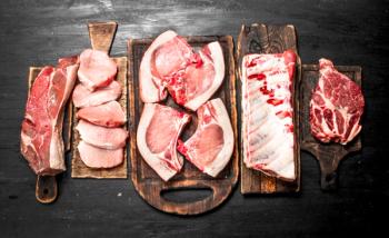 Different types of raw pork meat and beef. | Image Credit: © Artem Shadrin - stock.adobe.com