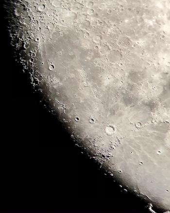 An image of the Moon silhouetted by darkness | Image Credit: © Jerome Workman, Jr.