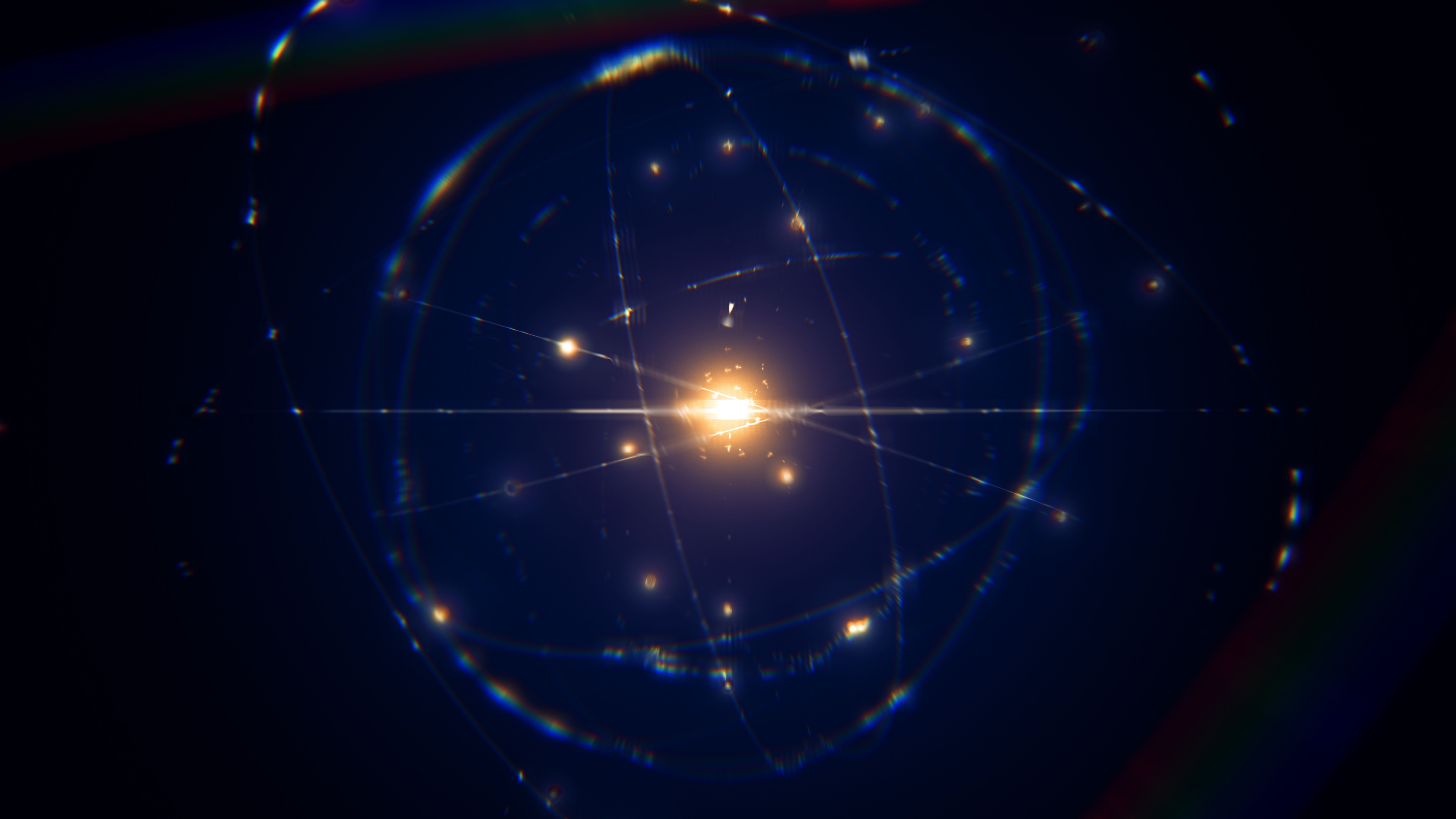 dynamic energetic blue indigo gold atom model concept illustration of glowing proton neutron nucleus, visualization of atom space physics, centric gravity, electrons orbiting as ordered real particles | Image Credit: © remotevfx - stock.adobe.com 