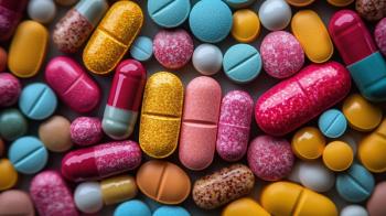 Top view of vibrant pink and blue pharmaceutical capsules and tablets with granular textures under soft lighting ideal for cosmetics-based healthcare branding and product visuals. Generated with AI. | Image Credit: © gleb - stock.adobe.com.