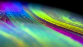 spectrum of bright greenish and purplish colors.