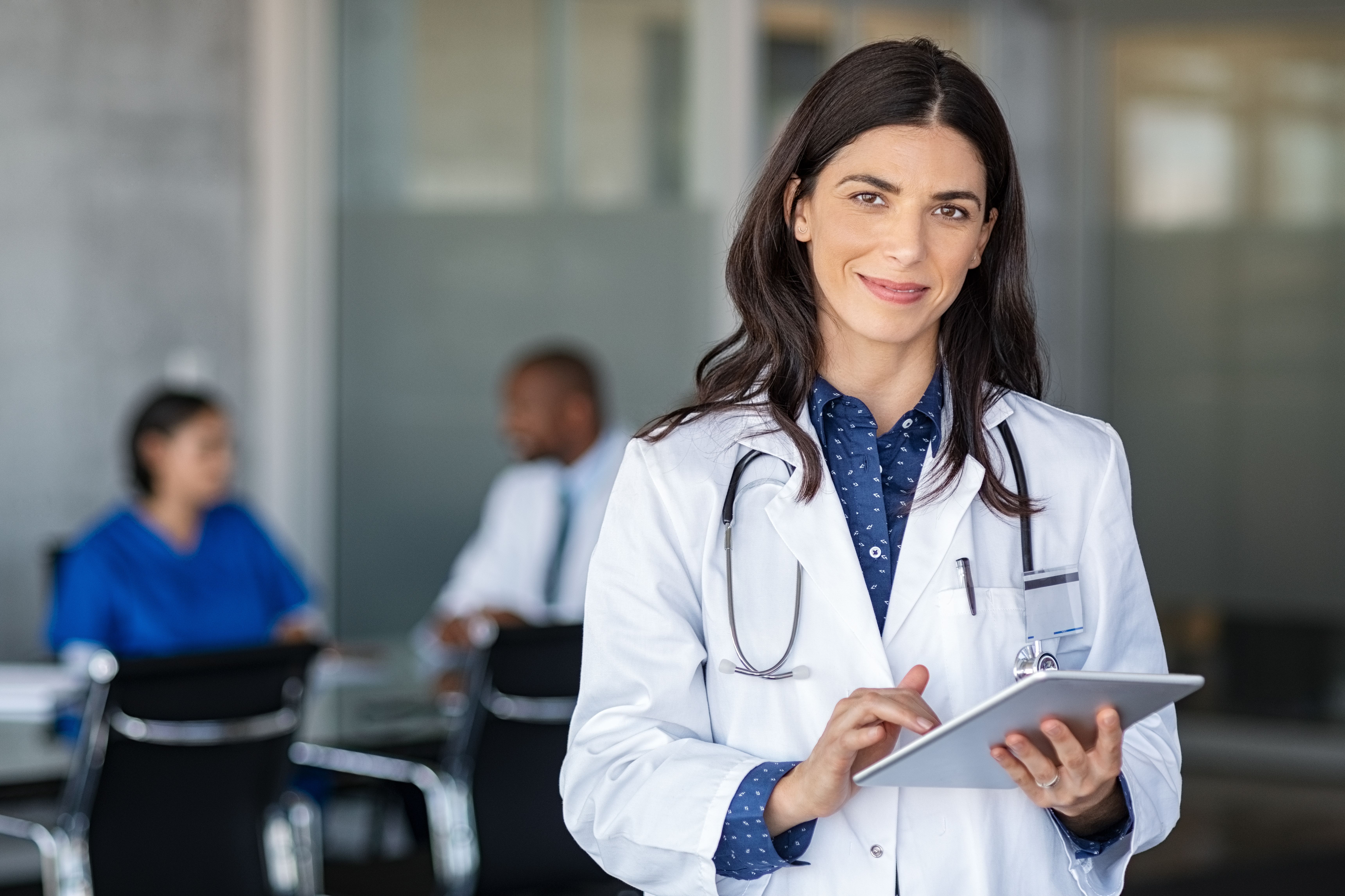 Doctor holding digital tablet at meeting room | Image Credit: © Rido - stock.adobe.com.