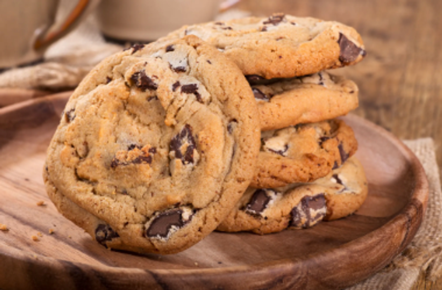Closeup of chocolate chip cookies on a wooden plate | Image Credit: © chas53 - stock.adobe.com