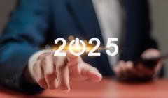 Happy New Year 2025. Concept of planning, start, career path, business strategy, opportunity and change. Businessman pressing the start button for 2025 on virtual screen. | Image Credit: © Pakin - stock.adobe.com
