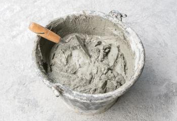 Pick up a trowel and cement mix concrete is compacted sand