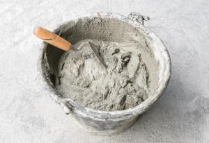 Pick up a trowel and cement mix concrete is compacted sand