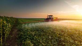 Tractor spraying pesticides on vegetable field with sprayer at spring | Image Credit: © Dusan Kostic - stock.adobe.com
