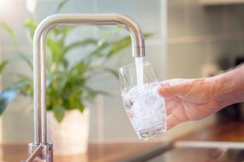 Filling up a glass with drinking water from kitchen tap | Image Credit: © Brian Jackson