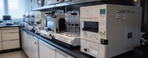 Modern laboratory equipment on a clean bench, featuring advanced analytical devices for scientific research and experimentation. Generated by AI. | Image Credit: © K-Signature - stock.adobe.com.