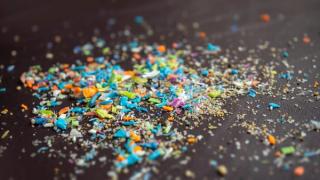 Close-up on microplastic particles. The concept for water pollution and global warming. Macro shot on a bunch of microplastics that cannot be recycled. | Image Credit: © SIV Stock Studio - stock.adobe.com