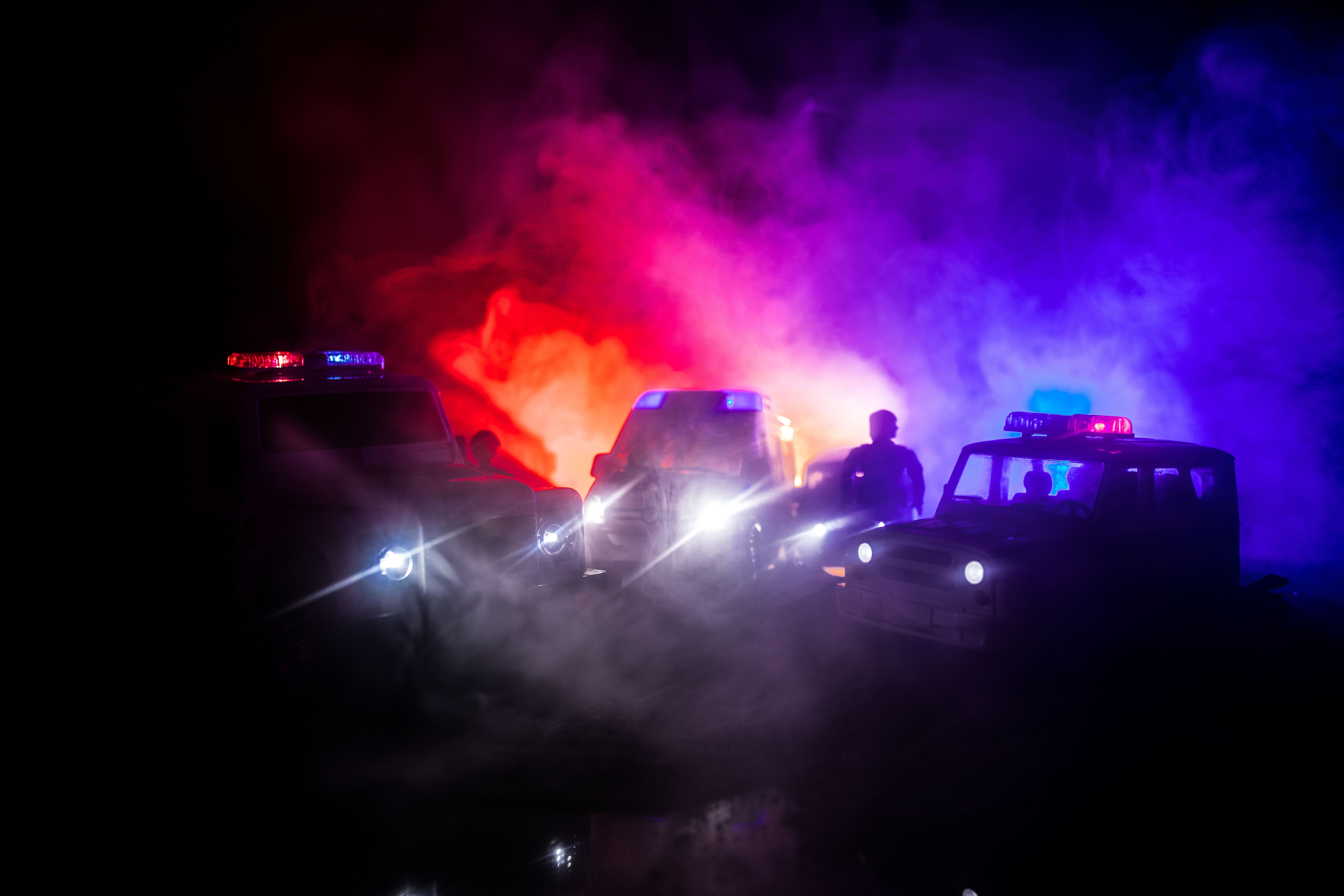 Police cars at night. Police car chasing a car at night with fog background. 911 Emergency response. Selective focus. | Image Credit: © zef art - stock.adobe.com