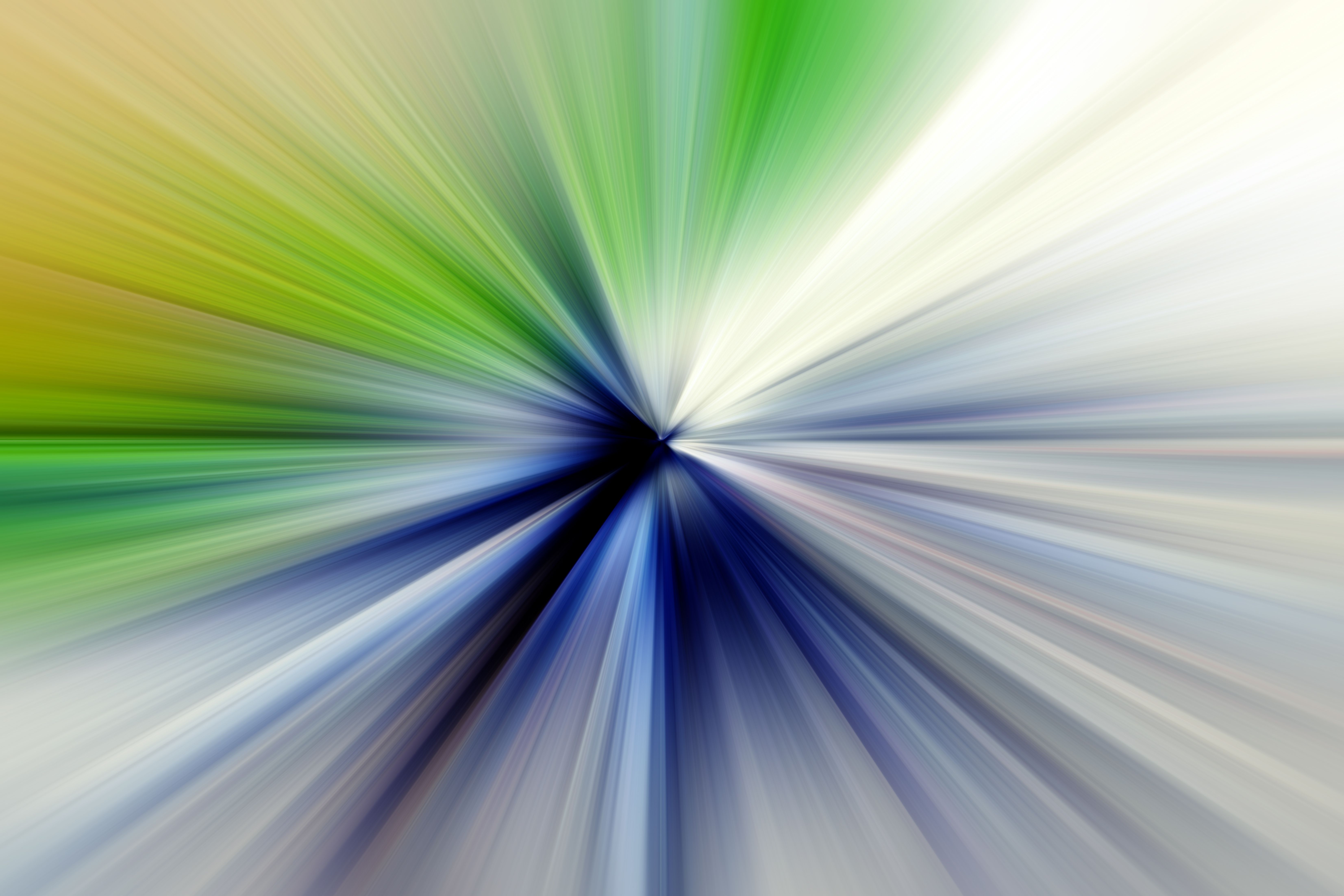 Abstract radial zoom blur surface of green, blue, grey tones. Blurry gentle background with radial, radiating, converging lines. | Image Credit: © kati17 - stock.adobe.com