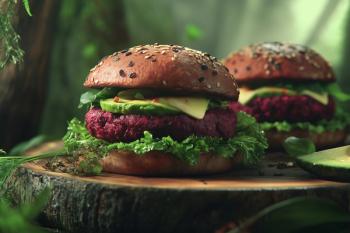 Plant-based burgers with beetroot patties, avocado, and lettuce served on a wooden platter. Generated with AI. | Image Credit: © Hassan Ramzan - stock.adobe.com