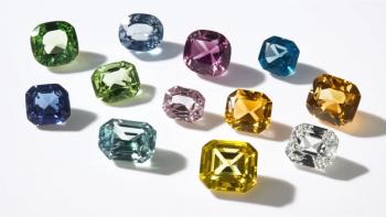 Scattered polished gemstones of different shapes and colors © Sampao-chronicles-stock.adobe.com