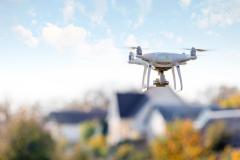 Drone flying front of home | Image Credit: © Ruslan Ivantsov - stock.adobe.com