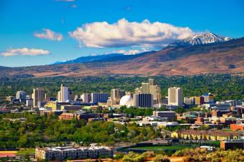 Downtown Reno skyline, Nevada, with hotels, casinos and surrounding mountains | Image Credit: © Nick Fox - stock.adobe.com