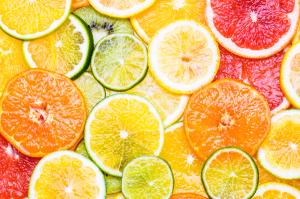 Citrus fruits background various slices top view background. Vitamin c fruits. | Image Credit: © travelbook - stock.adobe.com